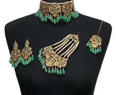 Handcrafted mint green / sea green golden diamonte Indian wedding / bridal choker jewellery set. Set includes- Earrings  Choker necklace Tikka  Jhumar Our choker is adjustable with a dori at the back giving you a comfortable fit. It comes with elegant earrings with gem detail, tikka and jhumar with hooks.  The glimmer of the diamonte gems with elegant diamonte detail make this jewelry set a truly head turning piece, a must have for every jewellery box.  Our ethnic jewellery set harmoniously blen Pakistan Jewelry, Lime Wedding, Choker Jewellery, Bridal Choker, Indian Jewelry Sets, Green Sea, Jewelry Choker, Jewellery Set, Wedding Jewellery