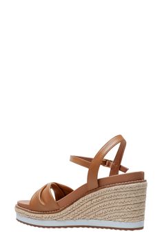 Espadrille-inspired braiding accentuates the wedge heel of this strappy leather sandal. 3 3/4" heel Cushioned footbed Leather upper/synthetic lining/rubber sole Imported Synthetic Wedge Sandals With Heel Loop For Vacation, Beach Wedge Heel Sandals With Heel Strap, Wedge Heel Sandals With Heel Strap For Beach, Strappy Synthetic Wedge Sandals For Vacation, Vacation Wedge Sandals With Heel Strap And Open Heel, Vacation Wedge Sandals With Heel Loop, Wedge Heels With Heel Loop For Vacation, Closed Toe Straw Wedge Sandals With Cushioned Footbed, Wedge Heel Sandals With Cushioned Footbed