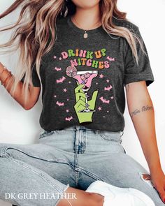 Is margarita or cocktails your "witches brew"? The "Drink Up Witches" shirt is perfect for anyone ready to brew up a good time at Halloween parties! Cheers, witches! ️🌙 I T E M * D E T A I L S Bella & Canvas® tee shirts are made with 4.2oz/142gsm ring-spun cotton jersey. It is soft and lightweight. Solid colors: 100% cotton Heather colors: 52% cotton 48% poly Gildan® long-sleeve tee shirts are made with 6oz/203gsm cotton jersey. Solid colors: 100% cotton Ash Grey: 99% cotton 1% poly Sport Grey Halloween Party Crew Neck Top, Halloween Party Tops With Letter Print, Halloween Party Letter Print Tops, Funny Short Sleeve T-shirt For Party, Crew Neck Tops With Letter Print For Costume Party, Fun Black Party T-shirt, Fun Black T-shirt For Party, Black Fun T-shirt For Casual Party, Halloween Party Graphic T-shirt