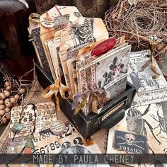 a table topped with lots of different types of cards and paper goods on top of each other