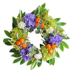 a wreath with oranges, purple flowers and green leaves