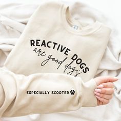 Our fun designs are printed on our coziest sweatshirt yet. It's soft, lightweight, and flattering on every type of body. My goal is to make that sweater that you love so much you wear it to sleep and roll out of bed straight into your morning dog walk. And don't forget that 5% of your sale goes directly to helping dogs (or their people) in need. Have a favorite organization to suggest for next month's donations? Send me a message! Follow me and Cody on Instagram for new releases, discount codes and fun content. I love to meet my customers and their pups and see all the amazing work you do! Tag me, DM me, or just come stalk at @ThePawsitiveInitiative. Pre-shrunk fabric makes choosing a size as easy as can be! Check out our size guide in the images, but if you have any questions don't hesita Funny Print Cotton Sweatshirt For Loungewear, Cotton Sweatshirt With Funny Print For Loungewear, Cotton Loungewear Sweatshirt With Funny Print, Relaxed Fit Sweatshirt With Funny Print For Loungewear, Casual Dog Print Sweatshirt For Winter, Casual Winter Sweatshirt With Dog Print, Comfortable Fit Graphic Print Sweatshirt, Comfortable Graphic Print Sweatshirt, Casual Crew Neck Sweatshirt With Dog Print