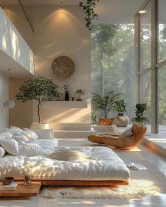 a living room filled with lots of white furniture and plants on the wall next to large windows