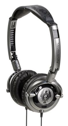 the headphones are black and silver with an emblem on each earpiece, which is attached to a metal stand