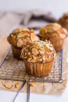 three muffins sitting on top of a cooling rack