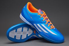 a pair of blue and orange soccer shoes