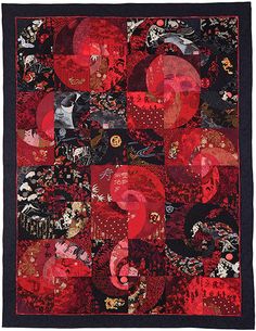 a red and black quilt with many different designs