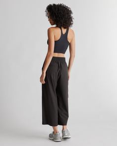 These look like classic work pants, but move like your favorite activewear. Our cropped Performance Tech Wide Leg Commuter Pants have just the right amount of stretch for days when you’re on the go, plus the sun protection and quick-dry properties of top-notch performance wear. And they look great with sneakers.  | Quince | Women's Performance Tech Wide Leg Pants in Black, Size Large, Recycled Polyester Functional Elastane Pants For Gym, Functional Elastane Gym Pants, Functional Sports Pants In Elastane, Functional Elastane Sports Pants, Functional Sport Pants Made Of Elastane, Athleisure Elastane Pants With Moisture-wicking, Athleisure Moisture-wicking Elastane Pants, Functional Elastane Workout Pants, Sportswear Bottoms With 4-way Stretch