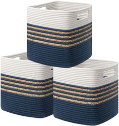 three blue and white baskets with gold stripes