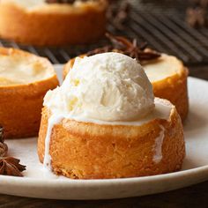 two desserts on a white plate with nuts