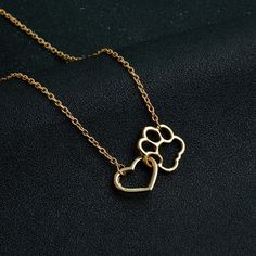 Dog Paw Heart Necklace: A Symbol of Love and Devotion Are you a dog lover looking for a meaningful piece of jewelry to express your love for your furry friend? Look no further than the exquisite Dog Paw Heart Necklace. With its elegant design and heartfelt symbolism, this necklace is the perfect accessory to showcase your bond with your canine companion. Express Your Love with the Dog Paw Love Necklace The Dog Paw Love Necklace is a stunning piece that captures the essence of your affection for your four-legged friend. Crafted with care and attention to detail, this necklace features a delicate heart pendant with a beautifully crafted dog paw design. The pendant hangs gracefully from a chain that is approximately 45 + 5cm in length, allowing it to rest comfortably around your neck. A Timel Therian Ideas, Unique Wedding Earrings, Paw Bracelet, Paw Print Bracelet, Paw Heart, Paw Print Necklace, Animal Earrings, Pet Necklace, Dog Paw