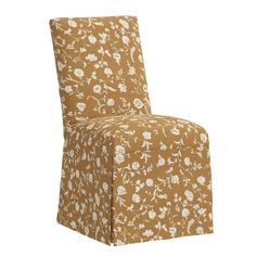 an upholstered chair with a floral pattern on it's back and seat cover