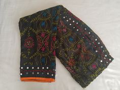 Beautiful ethnic raw  (chanderi) silk phulkari pants , embroidery with multicolor wool handcrafted with lining inside.Best quality. This pant gives a good ethnic look when paired with plain chikan Kurtas or plain kurtas.This pant has a mirror kind of ornamentation on below to give rich look. Length 39 inches Size L is ( US 10-12 sizes)          Black 2 sizes( L and XL)          Red fits M,L          Royal blue M,L          Beige fits M,L          Yellow fits S          Pink  M,L          Purple Bollywood Style Festive Bottoms With Mirror Work, Festive Bollywood Bottoms With Mirror Work, Traditional Multicolor Festive Pants, Traditional Chanderi Pants With Zari Work, Festive Chanderi Pants With Resham Embroidery, Festive Chanderi Pants, Bollywood Style Festive Pants With Zari Work, Festive Bollywood Chanderi Pants, Bollywood Style Festival Pants With Dupatta