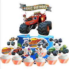 a birthday cake with monster trucks and cupcakes