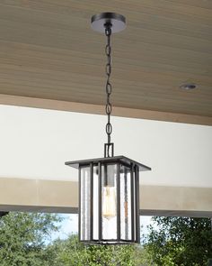 an outdoor light hanging from the ceiling