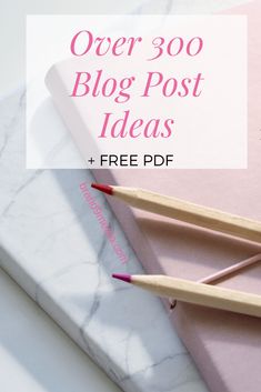 two pencils on top of a pink book with the title over 300 blog post ideas