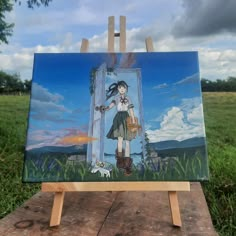 an easel with a painting of a girl holding a dog