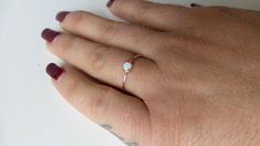 Opal Ring 14k Gold / 14k Gold Opal Ring / 14k Rose Gold Opal Ring / White Australian Opal Ring / Dainty Opal Ring / Alternate Engagement Ring / Opal Engagement Ring / Delicate Opal Ring / Natural Opal Ring / October Birthstone / Natural Gemstone / Rose Gold Opal Ring / Birthday Gift / Layering Opal Ring / One of a kind / Stackable Opal Ring / Solitaire Opal Ring EACH PICTURE WAS TAKEN UNDER DIFFERENT LIGHT SO YOU CAN REALLY APPRECIATE THE WIDE SPECTRUM OF COLORS OF THE OPAL. Free Shipping within Minimalist 14k Gold Opal Promise Ring, Dainty Birthstone Ring For Formal Occasions, Formal Minimalist Opal Ring, Rose Gold Midi Wedding Rings With Birthstone, Minimalist Opal Promise Ring With Round Band, Dainty Rose Gold Round Ring, Dainty Rose Gold Midi Rings For Formal Occasions, Minimalist Rose Gold Midi Rings With Birthstone, Dainty Moonstone Ring For Formal Occasions