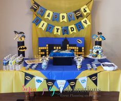 a batman themed birthday party with blue and yellow decorations