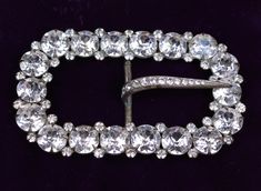 This is a handsome, glittery Edwardian belt buckle from the 1910s.  Condition is excellent vintage. All the original prongs hold the original glass sets in place, and all are present. It has an impressive look!  The buckle was well made, and works well.   This gorgeous vintage buckle would be lovely for a bride, and for use with period costumes. DIMENSIONS Length x width:  3.125 inches x 2 inches Thanks for looking! Edwardian Belt, Shell Ring, Period Costumes, Glass Set, Belt Buckle, Beautiful Bracelet, Prong Setting, Belt Buckles, Diamond Bracelet