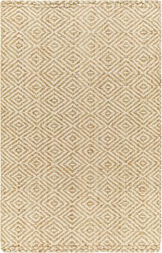 a beige rug with an intricate pattern on it