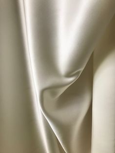 "Gorgeous and luxurious NATURAL WHITE silk charmeuse. Much lovelier up close, rich color. Silk satin with crepe back. 30 mm, which is denser and OPAQUE. Perfect for evening wear or bridal gown. \"What is Momme in silk fabric? Mommes (mm), is a unit traditionally used to measure the weight of silk fabrics. One momme = 4.340 grams per square meter; 8 mommes is approximately 1 ounce per square yard or 35 grams per square meter.\" Imported. Sold by the yard. $45 per yard 45 inch width. Dry clean. 10 Luxury Elegant Raw Silk Fabric, Aesthetic Therapy, Materials Gown Style, Moon Fabric, Small Business Cards, Silk Curtains, Minimalist Apartment, Gown Style, Silk Fabrics