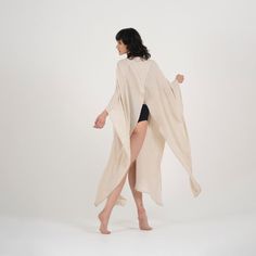 Step up your beach attire with our Elaine Linen Kimono & Beach Cover-Up. Crafted from linen, it's perfect for relaxing or taking a stroll along the shore. The versatile beige color complements any outfit, while the loose fit accommodates most body types.Featuring a stylish V-neck design, long sleeves, and pockets on each side, this kimono offers both style and practicality. With its easy button closure, it's a breeze to slip on over your swimsuit for quick coverage. Whether you're lounging by th Beachwear Cover-up Wrap For Loungewear, Beachwear Wrap Cover-up, Linen Cover-up For Spring Vacation, Beachwear Linen Cover-up For Vacation, Long Beach Season Cover-up For Loungewear, Linen Beachwear Cover-up For Spring, Summer Linen Cover-up For Beach Season, Linen Beach Cover-up, Linen Beach Cover-up For Beach Season