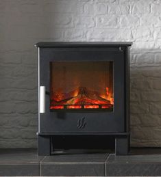 an electric fireplace with fire burning in it