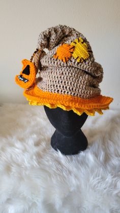 a crocheted hat is sitting on top of a mannequin's head