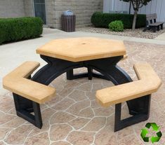 two wooden benches sitting next to each other on a patio