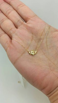 "14k Solid Yellow Gold Claddagh Celtic Crown Heart Pendant Necklace(DSN3649p230) Material: 14K Solid Gold Length: 17\" Weight: Approx 1.05g (light and dainty) Please note that all of my items are 100% genuine 14k solid gold. Please be confident, none are plated or filled they are solid 14k gold. Let's Stay Connected FOLLOW ME ON INSTAGRAM @THEHONESTJEWELER FOR SPECIAL DEALS AND GIVEAWAYS Return Policy 100%satisfaction is my goal. If you are not completely satisfied, I will gladly return the full Celtic Crown, Irish Necklace, Claddagh Necklace, Gold Claddagh Ring, Jewelry Vendor, Irish Claddagh, Ring Bracelet Chain, Sparkle Necklace, Irish Jewelry