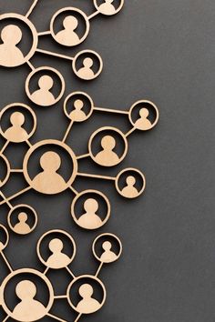 a group of wooden people connected by circles