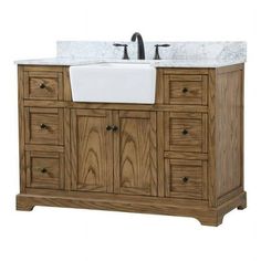 a bathroom vanity with two sinks and marble top