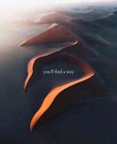 an aerial view of sand dunes with the words you'll find a way