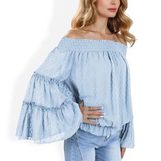 The Anna-Kaci Women's Off-Shoulder Bell Sleeve Top with Textured Dobby Pattern and Smocked Neckline is a feminine and elegant piece that adds a touch of boho-chic to your wardrobe. Crafted from lightweight, breathable fabric, this top features a textured dobby pattern that adds subtle sophistication. The smocked neckline allows for a comfortable off-shoulder fit, while the dramatic bell sleeves add a flowy and romantic vibe. Perfect for date nights, casual outings, or special occasions, this top Off-shoulder Tops With Smocked Bodice For Vacation, Blue Long Sleeve Off-shoulder Top For Spring, Spring Off-shoulder Blouse With Smocked Back, Spring Long Sleeve Off-shoulder Top With Smocked Bodice, Off-shoulder Blouse With Smocked Back, Spring Off-shoulder Smocked Top, Spring Peasant Off-shoulder Blouse, Summer Off-shoulder Blouse With Smocked Back, Off-shoulder Blouse With Smocked Bodice For Day Out