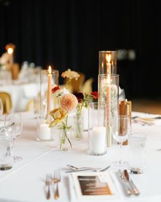 the table is set with candles and flowers