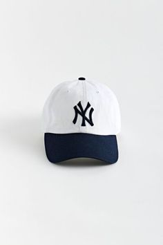 Cotton baseball cap by '47 brand. Structured 6-panel fabrication and topped with a New York Yankees logo to the front. Includes an adjustable closure at the back and finished with a curved brim.Features. Cotton cap from '47 New York Yankees logo embroidery Adjustable strap closure Content + Care. 100% Cotton Spot clean Imported Size + Fit. Adjustable circumference Cap Drawing, New York Yankees Logo, Yankees Logo, 47 Brand, Mens Fashion Trends, Baseball Hat, Logo Embroidery, New York Yankees, Embroidery Logo