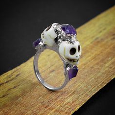 GemFormingStudio D E T A I L S Natural Purple Amethyst Skull Horror Handmade Multi-Stone Rough Gemstone Statement Ring for her , Engagement Ring Stone MM : 5 X 4 MM ( Approx ) Ring Size : (See all the variations) Weight : 3.88 gm Color : Multi Color Shape : Skull Shape Material : Copper Polish : All Polish Available Listing link for tourmaline skull earring : - https://www.etsy.com/listing/992470093/tourmaline-stud-earring-skull-stud?ga_search_query=skull&ref=shop_items_search_2&pro=1&am Collectible Halloween Skull Ring, Collectible Skull Rings For Halloween, Collectible Skull Ring For Halloween, Gothic Skull Wedding Rings, Skull Shaped Ring As Halloween Gift, White Gothic Skull Jewelry, Halloween Skull Ring As Gift, Halloween Skull Rings As Gifts, Halloween Skull Ring For Gift