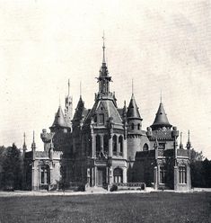 an old black and white photo of a large building with turrets on it's roof