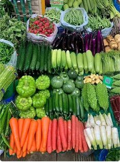 many different types of vegetables on display for sale