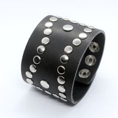 Dominic - oldschool design cuff bracelet for men or women. Wide platform - 5 cm can cover your wrist tattoo and also fix well. Cuff is decorated by rivets of rock style. Made of two layers of genuine leather, edges dyed. Bracelet is adjustable, there are 3 sizes 16,5 - 18 and 19 cm. Can be done in black or chocolate brown color. Suitable for wrist sizes from 16 till 19 cm, to get longer or shorten version contact me. ★ Similar style ★ ----------------------------- JD Matte black watches https:// Punk Style Leather Cuff Bracelet, Punk Cuff Bracelets With Rivets, Edgy Black Cuff Bracelet With Rivets, Black Leather Punk Bracelet With Silver Studs, Gothic Silver Wristband With Rivets, Silver Gothic Wristband With Rivets, Leather Watch Cuff, Chocolate Brown Color, Leather Bangle