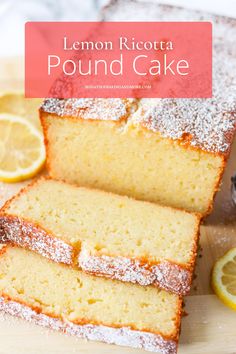 lemon ricotta pound cake on a cutting board with sliced lemons and powdered sugar