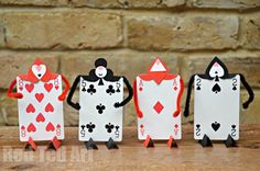 four playing cards made to look like people