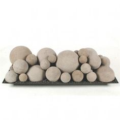 a pile of rocks sitting on top of a black tray