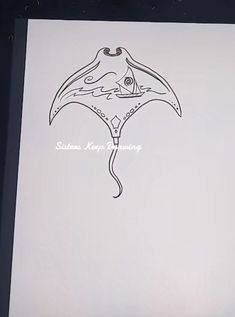 a black and white drawing of a manta ray on a piece of paper with writing underneath it