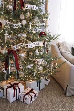 a decorated christmas tree with presents under it