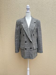 "For sale is a gorgeous vintage PENDLETON Classic double breasted blazer in glen plaid houndstooth pattern in black, white and pink colors. Made in USA. 100% Virgin Wool.  This fully lined blazer features padded shoulders, notched lapels, three pairs button down closure, imitation side pockets with flaps.  Absolutely gorgeous piece in a very good vintage condition. Marked size 12.  For a proper fit please see the measurements below. Measurements (flat): Shoulder to shoulder: 17\" Armpit to armpit: 22\" Sleeve length: 23,5\" Waist: 41\" Hips: 46\" Shoulder to hem: 29\"" Spring Formal Plaid Blazer, Classic Plaid Blazer For Work, Classic Plaid Outerwear For Office, Plaid Double-breasted Blazer For Business Casual, Classic Plaid Outerwear, Plaid Double-breasted Blazer For Office, Chic Plaid Blazer With Lapel Collar, Double-breasted Plaid Blazer For Office, Plaid Double-breasted Office Blazer