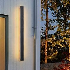 an outside view of a house with the lights on