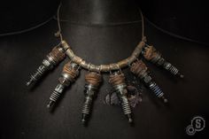 Angel of ignition - Post-apocalyptic necklace - Chumbucket necklace - Spark plugs - Shells - Junk jewelry by StrojePostApo on Etsy https://www.etsy.com/listing/617035779/angel-of-ignition-post-apocalyptic Wasteland Jewelry, Apocalyptic Jewelry, Wasteland Fashion, Apocalyptic Wasteland, Post Apocalyptic Clothing, Wasteland Warrior, Fallout Cosplay, Post Apocalyptic Costume, Apocalyptic Clothing