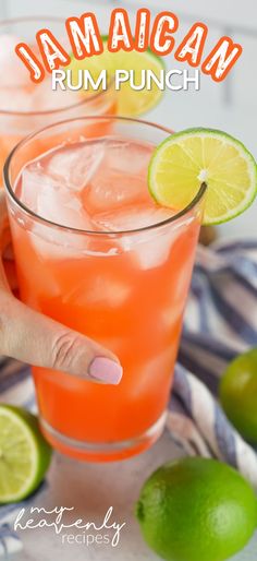 a hand holding a drink with limes around it and the words jamacan rum punch